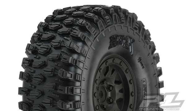 Proline Hyrax 1.9" G8 Rock Terrain TruckTires Mounted on Impulse Black Plastic Internal Bead-Loc Wheels